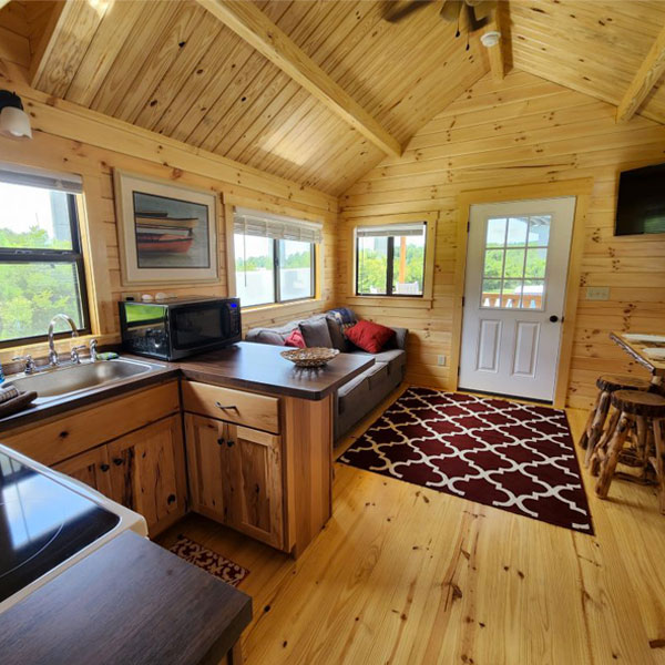 Cozy Cabin on the Coast 1 exterior with rocking chairs on the porch