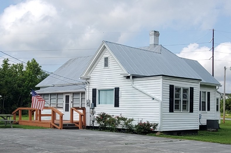 Country Farmhouse exterior with covered porch and deck