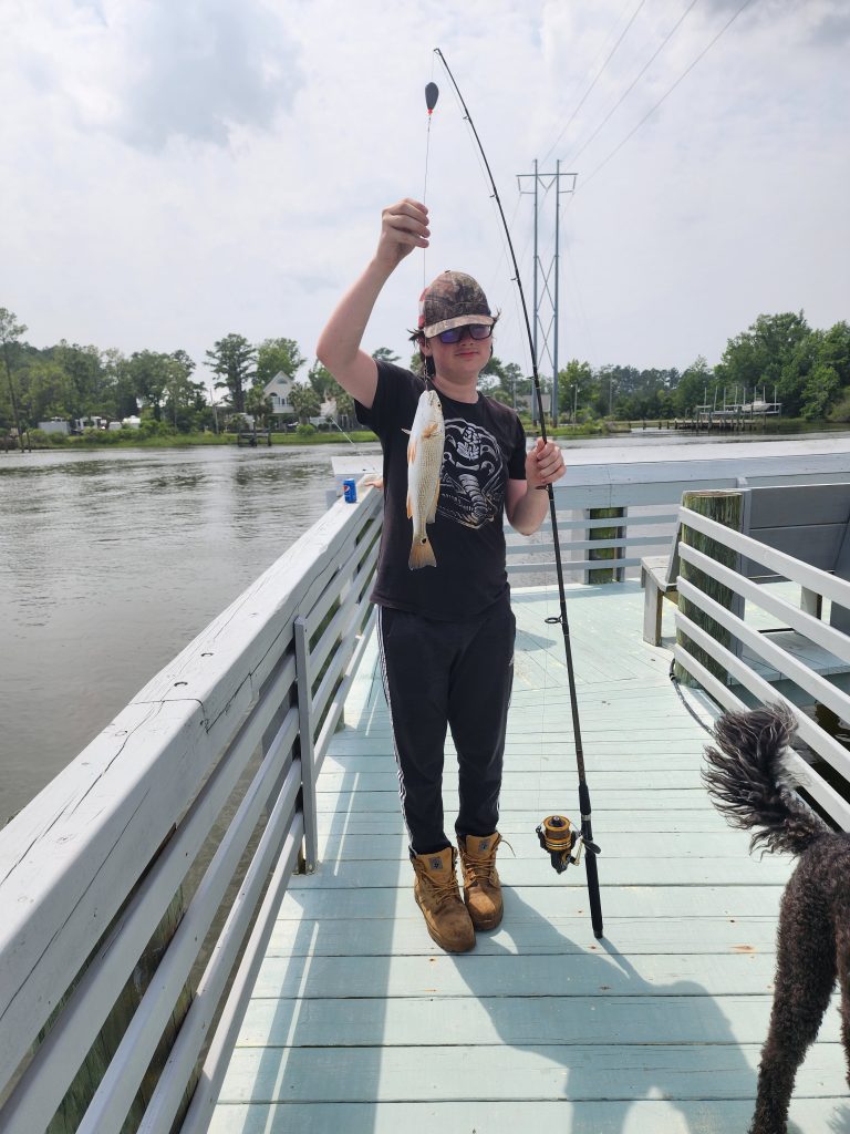 Guests fishing from the pier