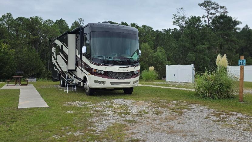 Ultra-premium back-in RV site RV22-172 occupied by a motorhome