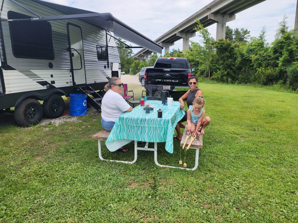 Three generations of a family relaxing on the waterfront