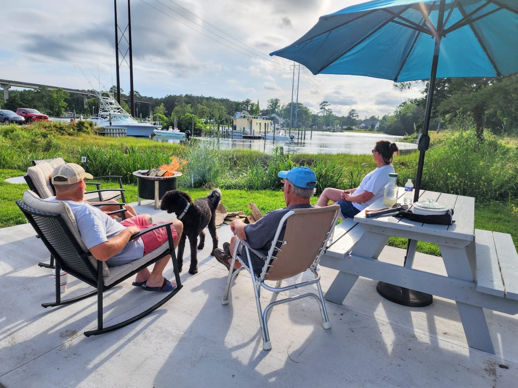 Concrete patio overlooking the marina with smokeless fire pits